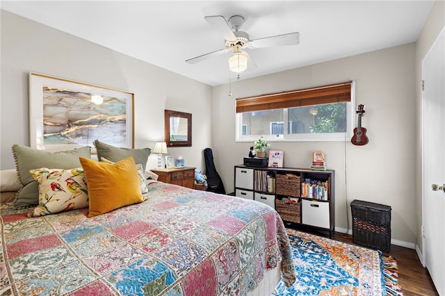 bedroom with hardwood / wood-style floors and ceiling fan