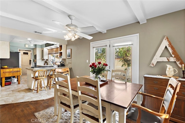 dining area featuring hardwood / wood-style floors, sink, beamed ceiling, and ceiling fan