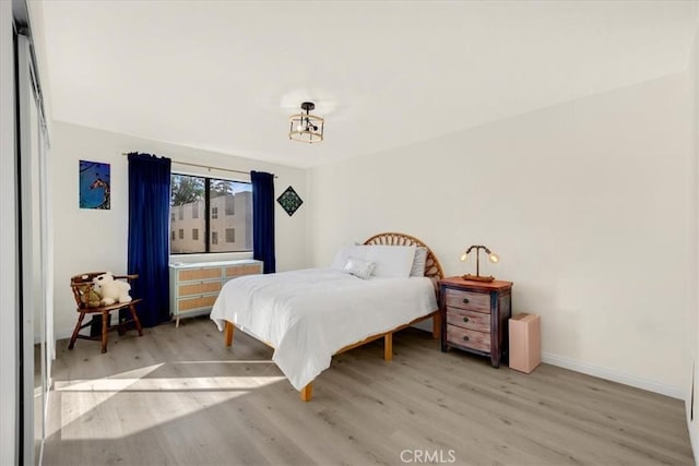 bedroom with light hardwood / wood-style floors