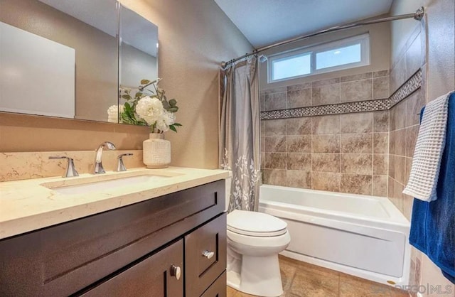 full bathroom with shower / bathtub combination with curtain, vanity, and toilet