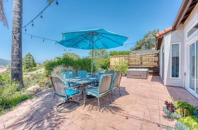 view of patio / terrace featuring a hot tub