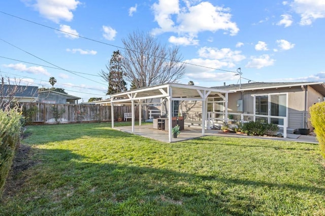 back of property featuring a patio area and a lawn