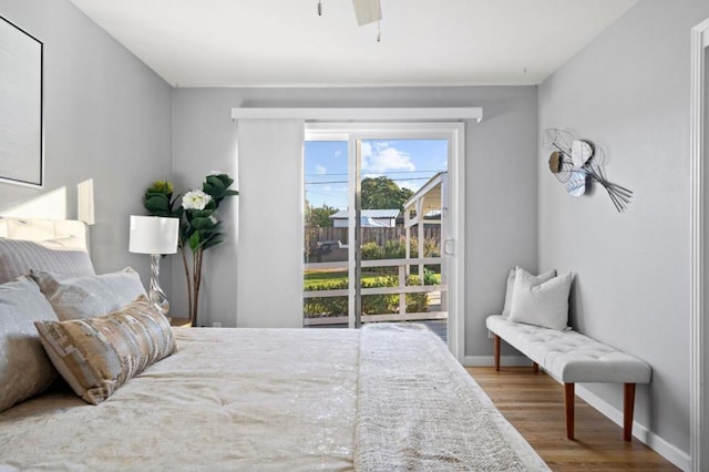 bedroom with hardwood / wood-style flooring and ceiling fan