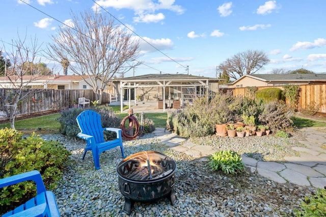 view of yard with an outdoor fire pit and a patio