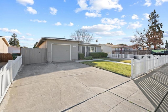 ranch-style house with a garage and a front lawn