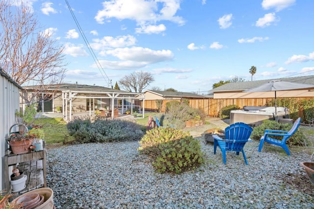 view of yard with a jacuzzi and a patio area