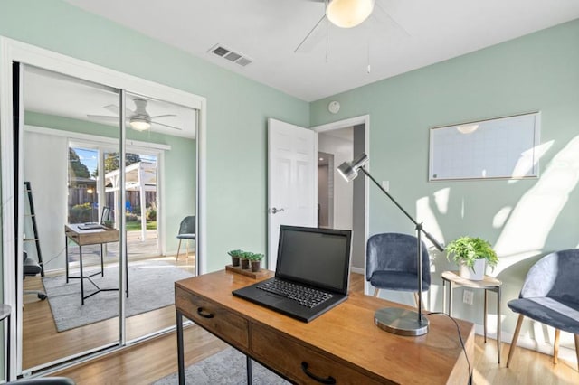 office space featuring ceiling fan and hardwood / wood-style floors