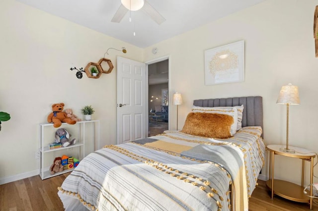 bedroom featuring ceiling fan and dark hardwood / wood-style flooring