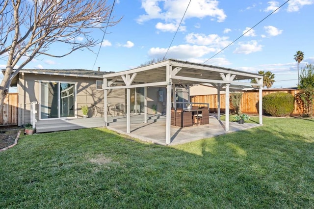 back of house with a yard and a patio area