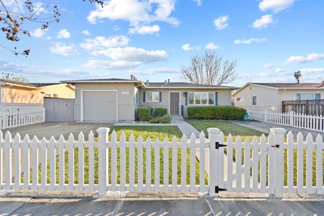 ranch-style home with a garage and a front yard