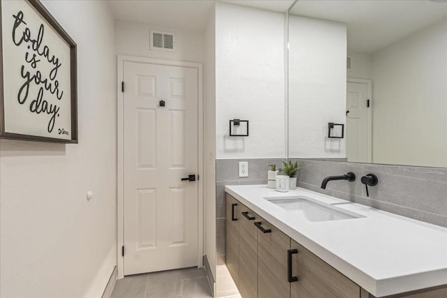 bathroom featuring vanity and tile patterned flooring