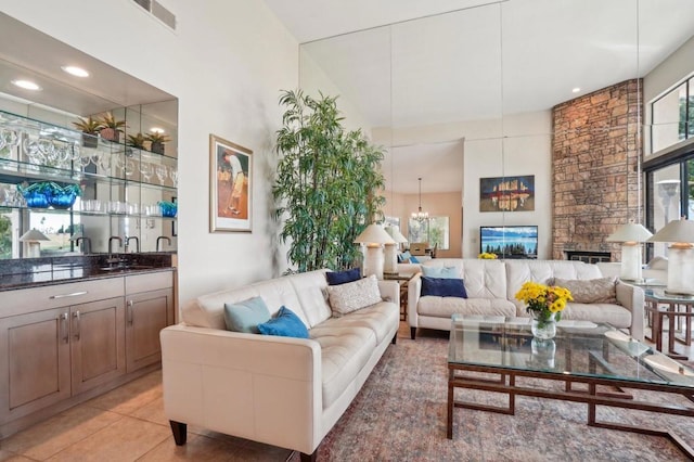 tiled living room with indoor bar and a fireplace