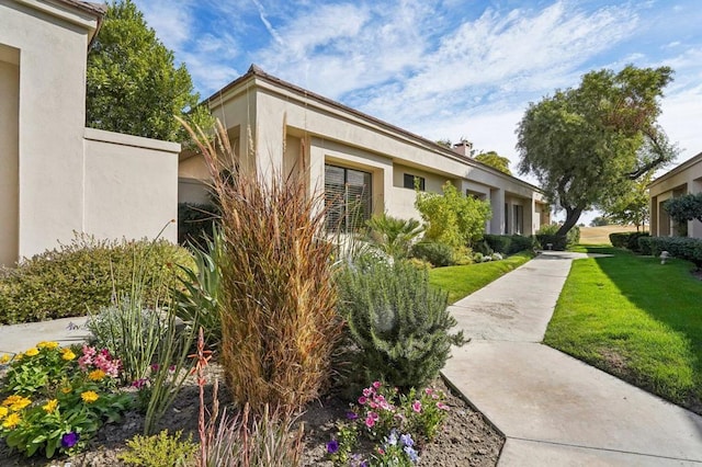 view of property exterior featuring a yard