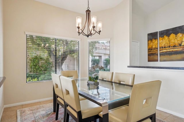 tiled dining space with a notable chandelier