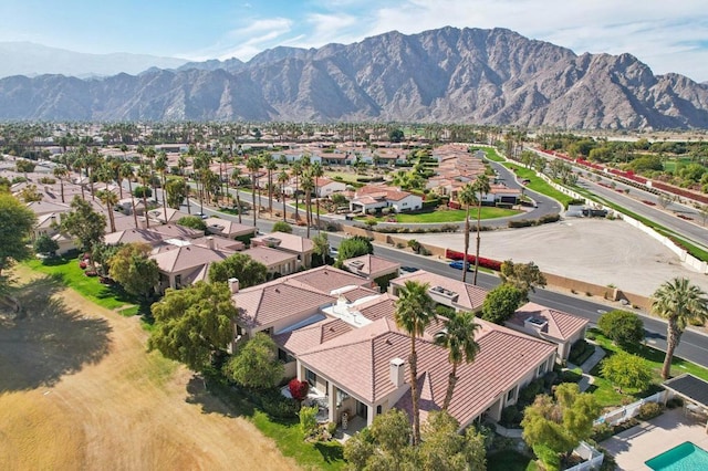 birds eye view of property featuring a mountain view