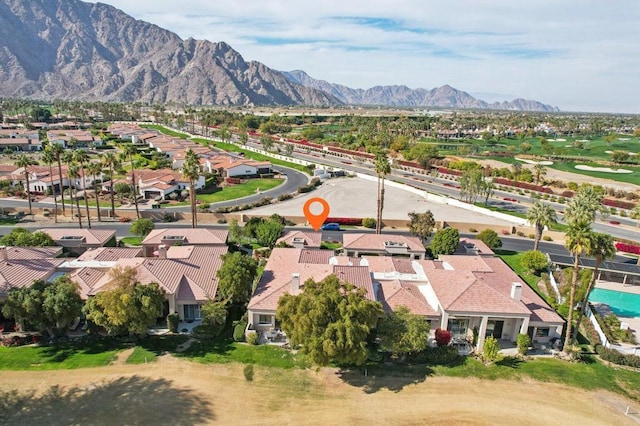 birds eye view of property with a mountain view