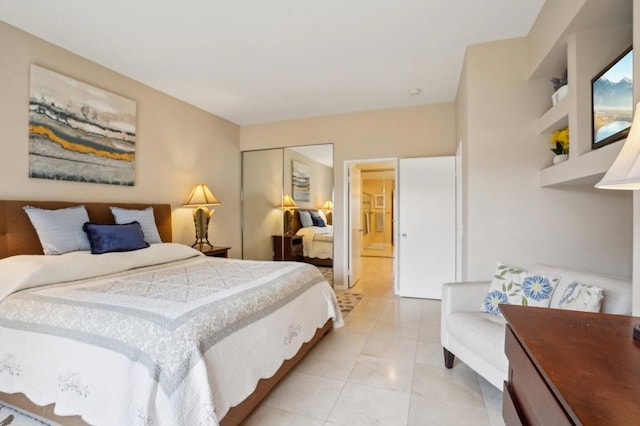 bedroom featuring light tile patterned flooring and a closet