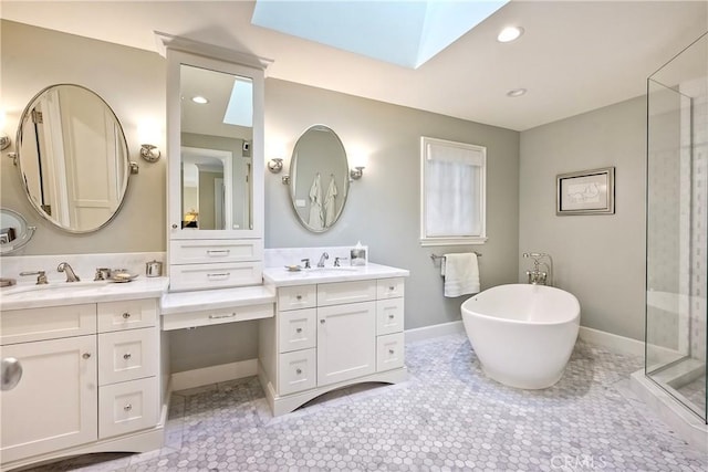 bathroom featuring a skylight, vanity, separate shower and tub, and tile patterned flooring