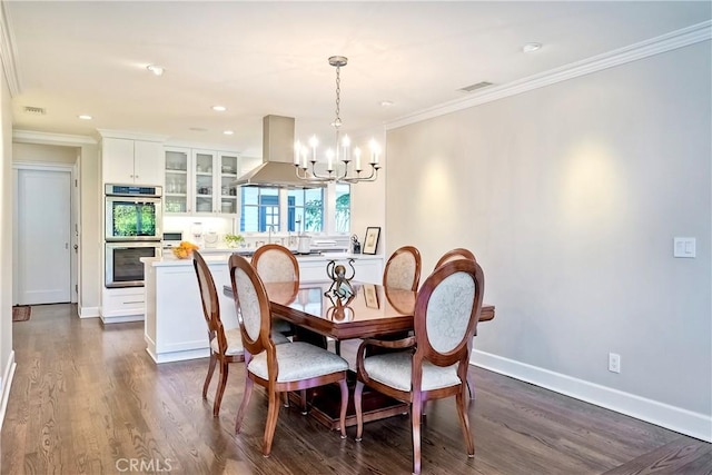 dining area featuring an inviting chandelier, crown molding, and dark wood-type flooring