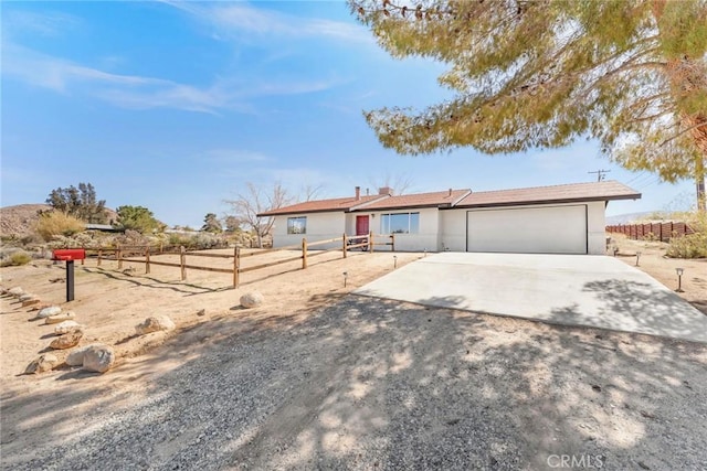 ranch-style house featuring a garage