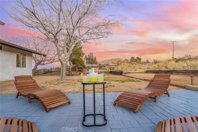 view of home's community with a mountain view and a patio