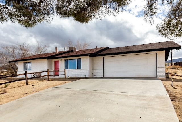 ranch-style home featuring a garage