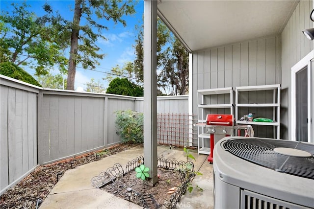 view of patio / terrace with a grill and central AC