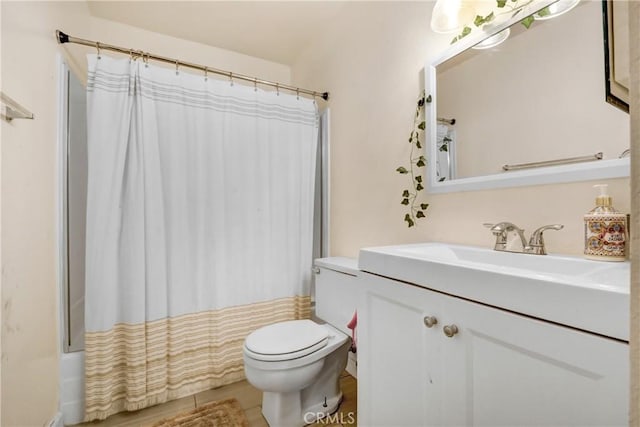 full bathroom featuring vanity, shower / tub combo, and toilet