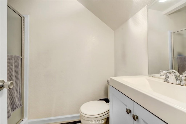 bathroom with vanity, walk in shower, and toilet