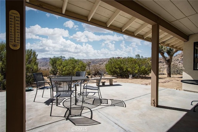 view of patio / terrace with a mountain view