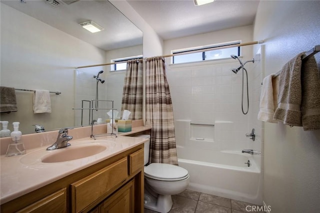 full bathroom featuring vanity, shower / bath combo, tile patterned floors, and toilet