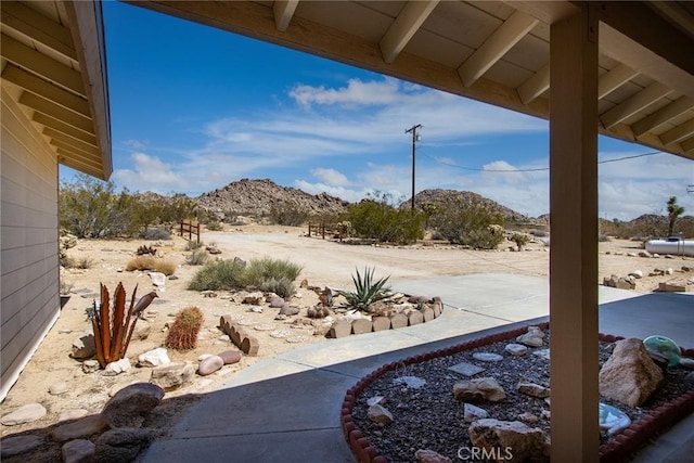 view of patio / terrace featuring a mountain view