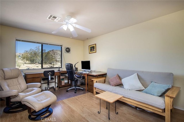 office area with ceiling fan and hardwood / wood-style floors