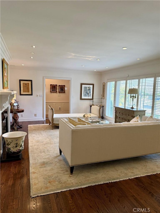 living room with hardwood / wood-style flooring and ornamental molding