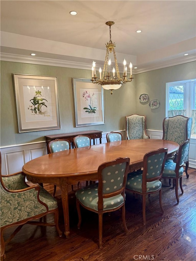 dining room featuring ornamental molding and dark hardwood / wood-style floors