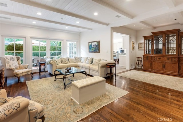 living room with beam ceiling and dark hardwood / wood-style floors