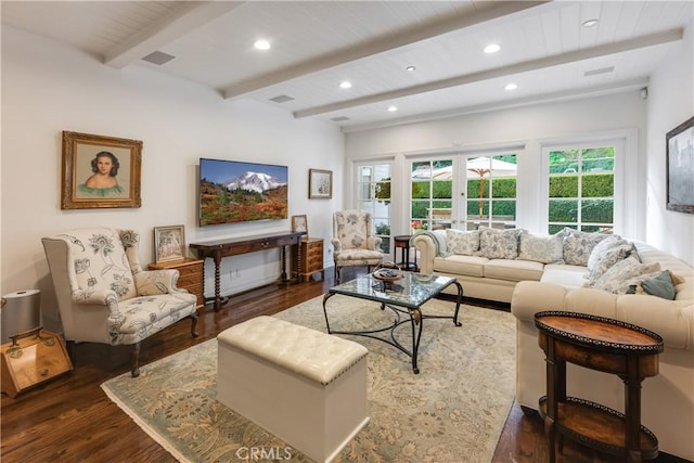 living room featuring beamed ceiling, dark wood-type flooring, and french doors