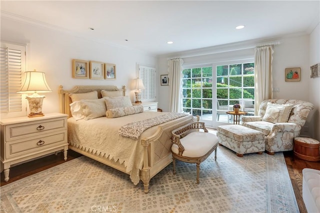 bedroom featuring wood-type flooring and ornamental molding