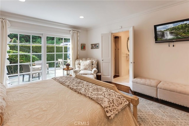 bedroom with hardwood / wood-style floors and crown molding