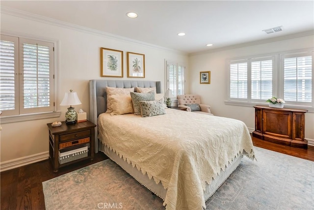 bedroom featuring dark wood-type flooring and crown molding