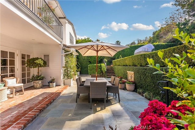 view of patio featuring a balcony