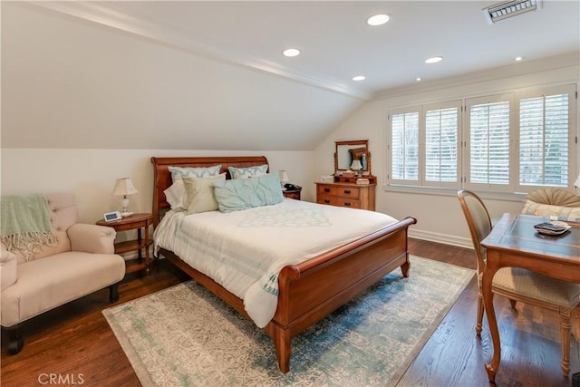 bedroom with dark hardwood / wood-style flooring and lofted ceiling