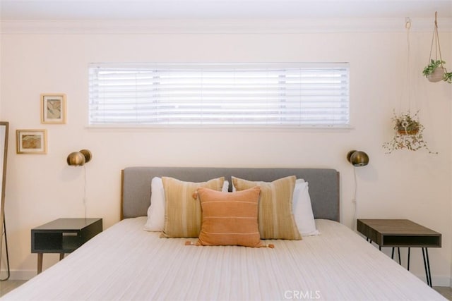 bedroom with ornamental molding