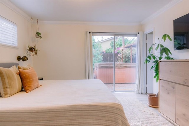 bedroom with access to exterior and crown molding