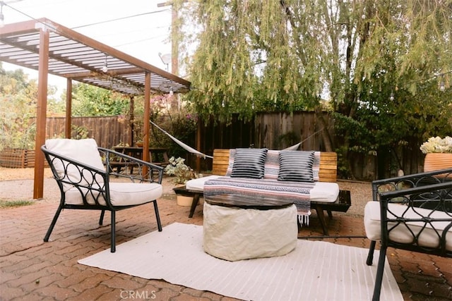 view of patio / terrace with an outdoor living space and a pergola