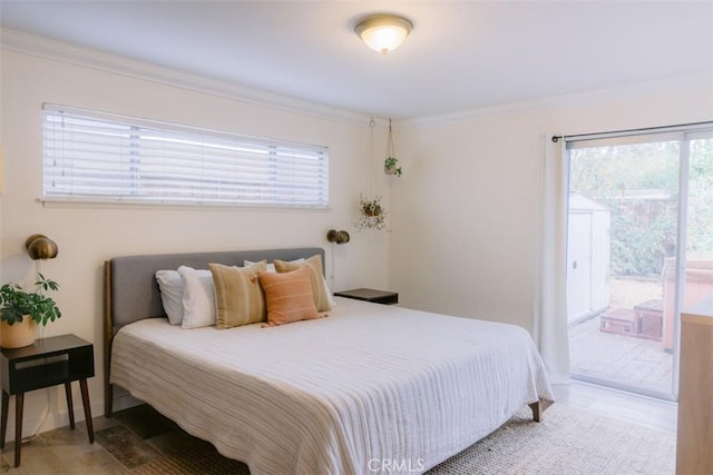 bedroom featuring access to exterior and ornamental molding