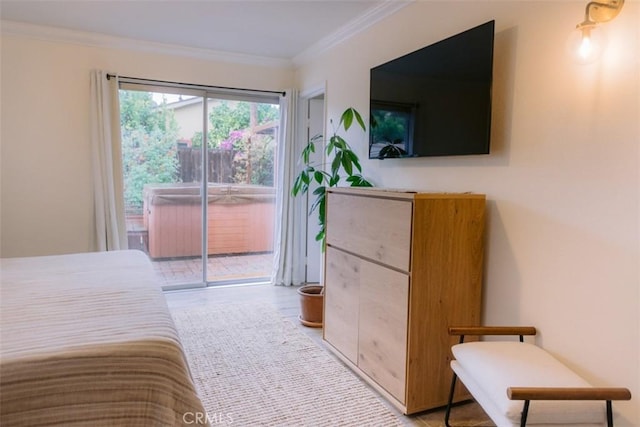 bedroom with crown molding, wood-type flooring, and access to outside