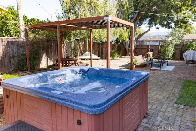 view of patio featuring grilling area and a hot tub