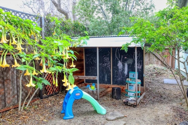 view of jungle gym with an outdoor structure