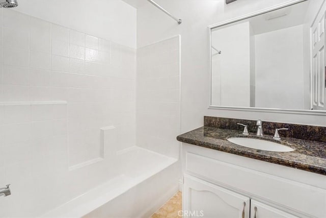 bathroom featuring vanity and washtub / shower combination